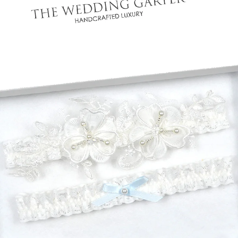 front - fastening women gartersLuxury Floral Flower Ivory Wedding Garter Set